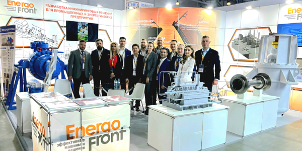 EnergoFront team at the exhibition stand with mock-ups of industrial equipment