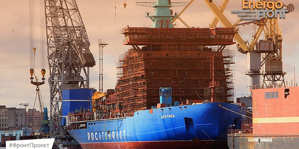 Icebreaker Arktika of Rosatomflot in the dock under the cranes at sunset