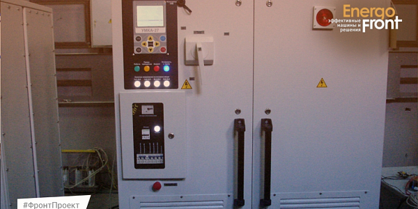 Gray electrical cabinet with UMKA-27 control unit and high voltage warnings