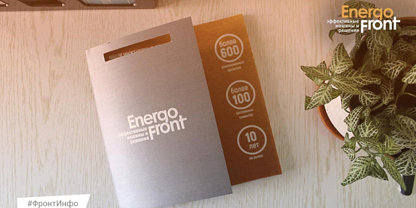 EnergoFront corporate brochures on the table with project and client numbers