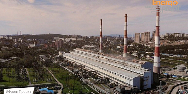 City CHPP with three striped pipes and a substation near the hills (Vladivostok CHPP-2)