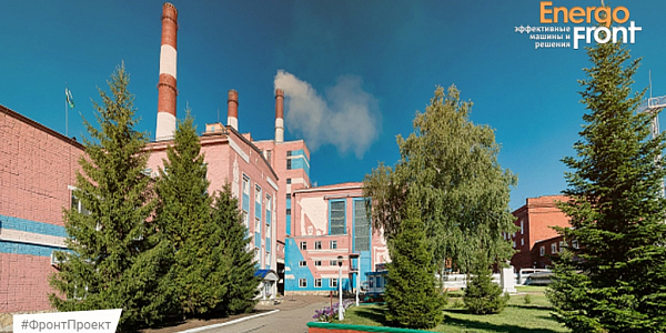 Red and white chimneys of a thermal power plant among spruce trees and lawns, the EnergoFront logo and the FrontProject hashtag