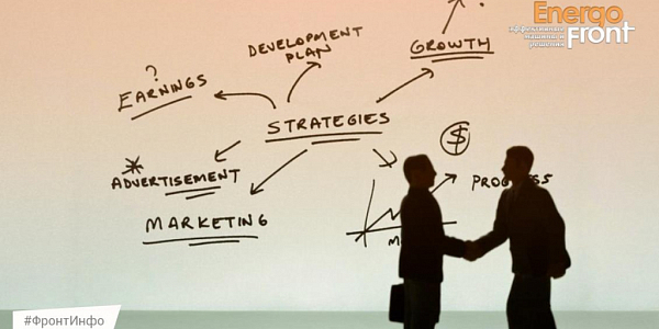 Silhouettes of two businessmen shaking hands against the background of a Strategies chart with growth arrows