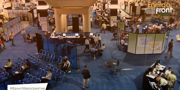Top view of the exhibition hall with blue carpet, stands and EnergoFront logo
