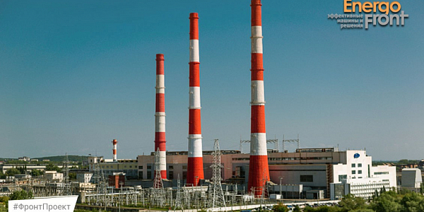 CHPP with three striped pipes and an open switchgear in front (Ufimskaya CHPP-2)
