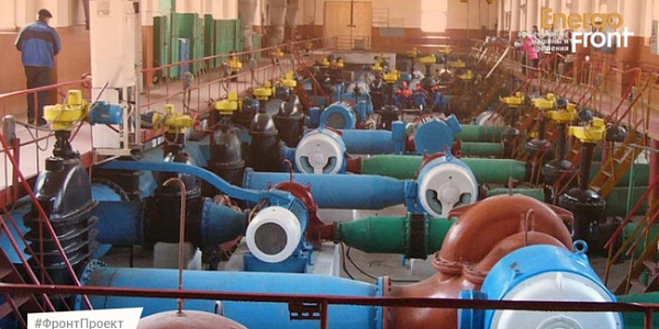 Machine room with rows of pumps, motors and large pipe fittings