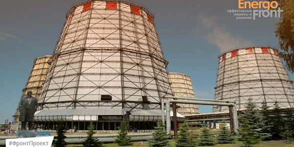 CHP cooling towers with checkered edge, monument and fir trees in foreground