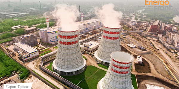 CHP cooling towers with steam and casings with blue and yellow trim